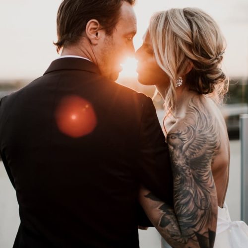bride and groom kissing at sunset by Michael Carr Ohio Wedding and Engagement Photographer