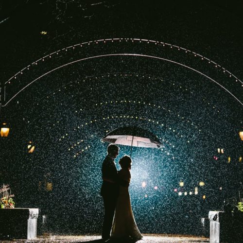 bride and groom in rain Michael Carr Ohio Wedding and Engagement Photographer