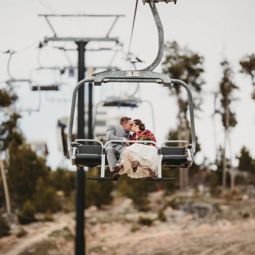 bride and groom on ski lift Michael Carr Ohio Wedding and Engagement Photographer