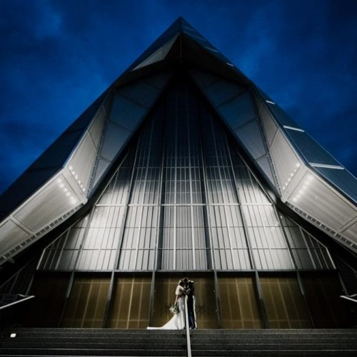 bride and groom in front of chapel by Michael Carr Ohio Wedding and Engagement Photographer