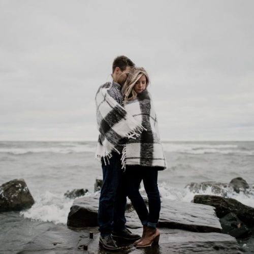 man and woman embracing on the beach by Michael Carr Ohio Wedding and Engagement Photographer
