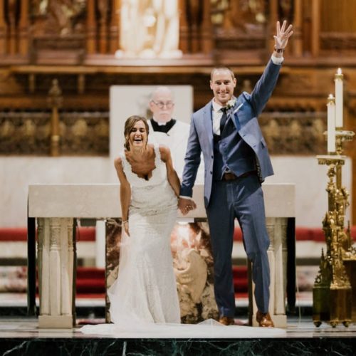 bride and groom at the end of ceremony laughing by Michael Carr Ohio Wedding and Engagement Photographer