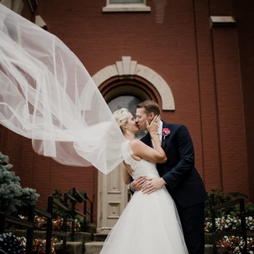 bride and groom kissing by Michael Carr Ohio Wedding and Engagement Photographer