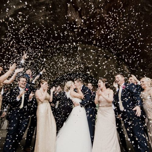 bride and groom kissing under confetti by Michael Carr Ohio Wedding and Engagement Photographer