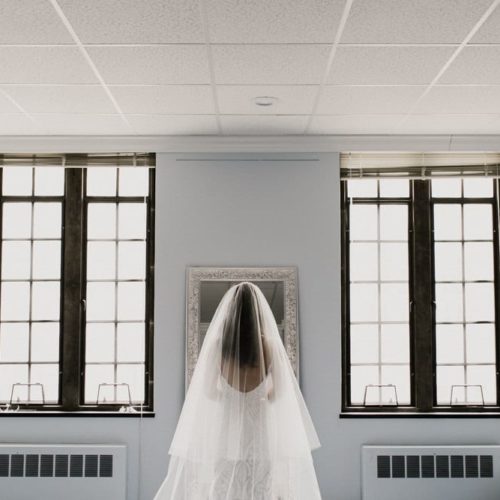 bride in front of mirror by Alex Grodkiewicz Dayton Ohio Wedding and Engagement Photographer
