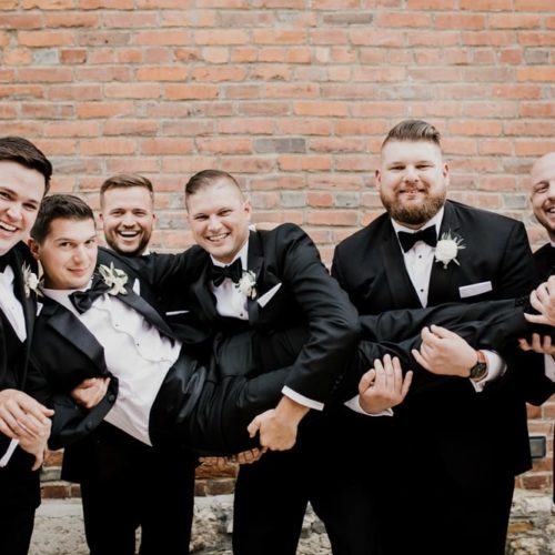 groomsmen holding groom by Alex Grodkiewicz Dayton Ohio Wedding and Engagement Photographer
