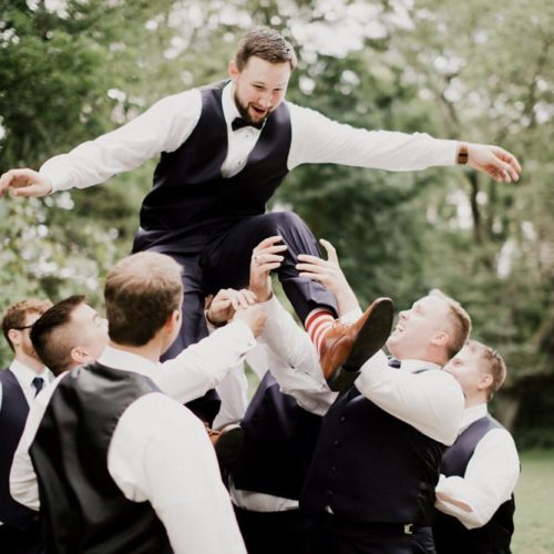 groom and groomsmen having fun by Alex Grodkiewicz Dayton Ohio Wedding and Engagement Photographer