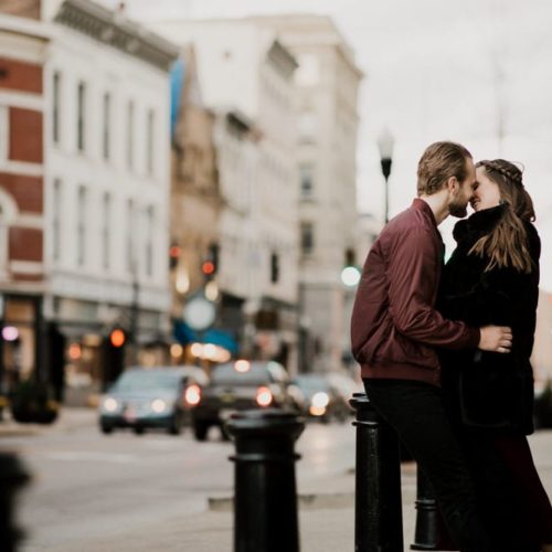 couple kissing on street corner by Dayton Ohio Wedding Photographer Josh Ohms