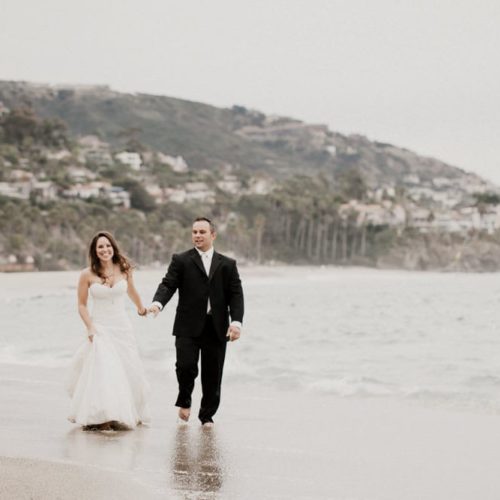bride and groom walking on a beach by Dayton Ohio Wedding Photographer Josh Ohms