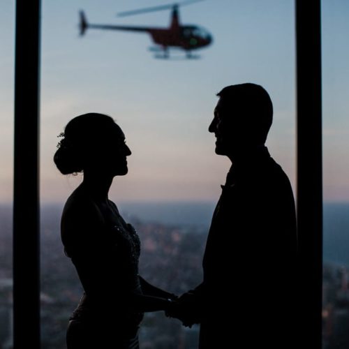 silhouette of bride and groom in front of city by Dayton Ohio Wedding Photographer Josh Ohms