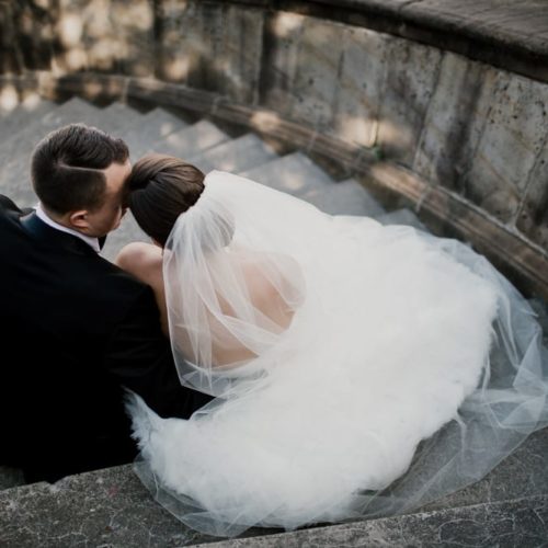 bride and groom sitting together on stairs by Dayton Ohio Wedding Photographer Josh Ohms