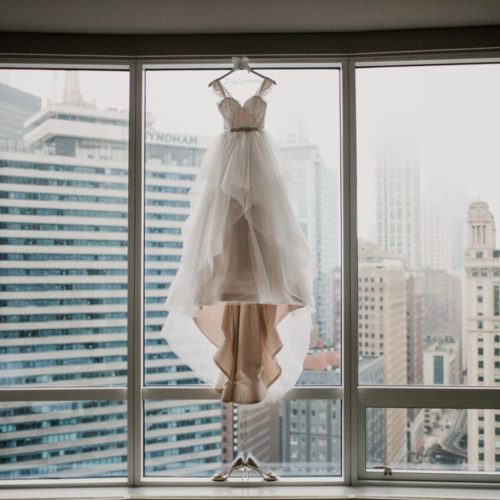 wedding dress hanging with city in the background by Dayton Ohio Wedding Photographer Josh Ohms
