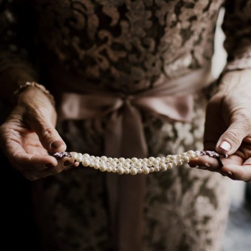 woman holding pearls by Dayton Ohio Wedding Photographer Josh Ohms