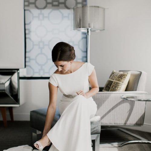 bride putting on shoes by Dayton Ohio Wedding Photographer Josh Ohms