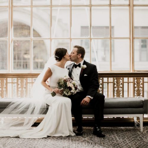 bride and groom kissing on bench by Dayton Ohio Wedding Photographer Josh Ohms