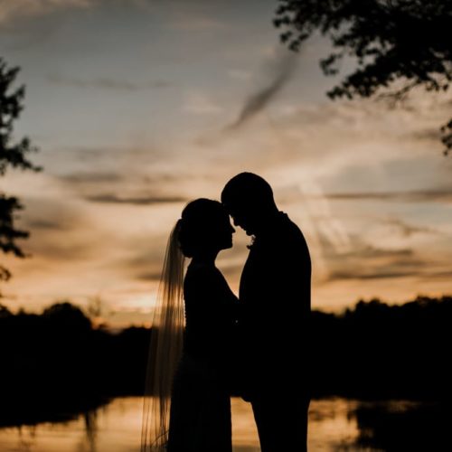 bride and groom foreheads together at sunset by Dayton Ohio Wedding Photographer Josh Ohms