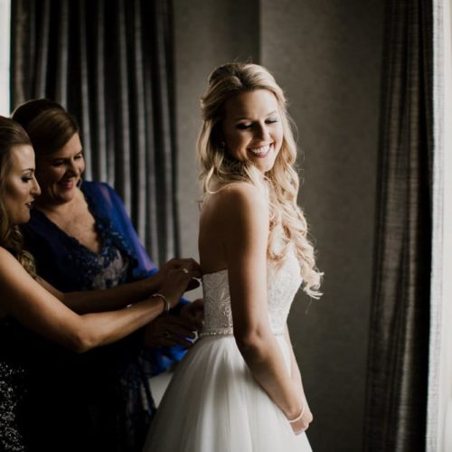 bride getting in dress by Dayton Ohio Wedding Photographer Josh Ohms