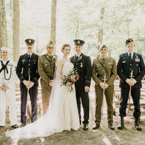 bride and groom standing with men in military uniform by Dayton Ohio Wedding Photographer Josh Ohms