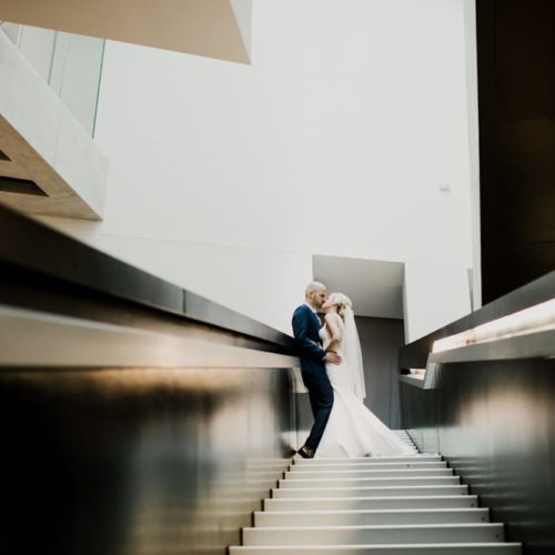 bride and groom kissing on stairs by Dayton Ohio Wedding Photographer Josh Ohms