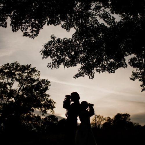 couple looking through binoculars by Dayton Ohio Wedding Photographer Josh Ohms