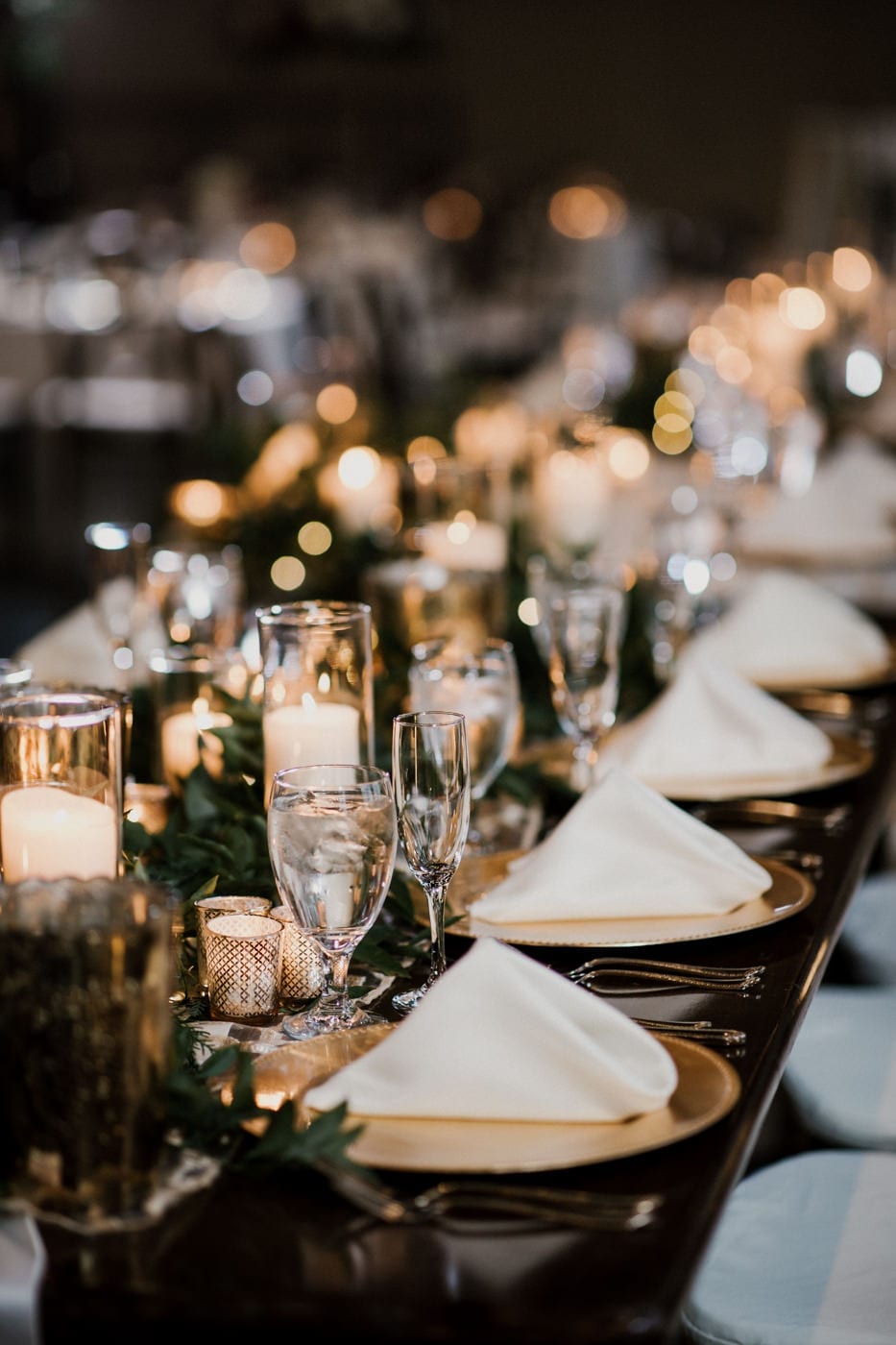 reception table with folded napkins at black tie winter wedding