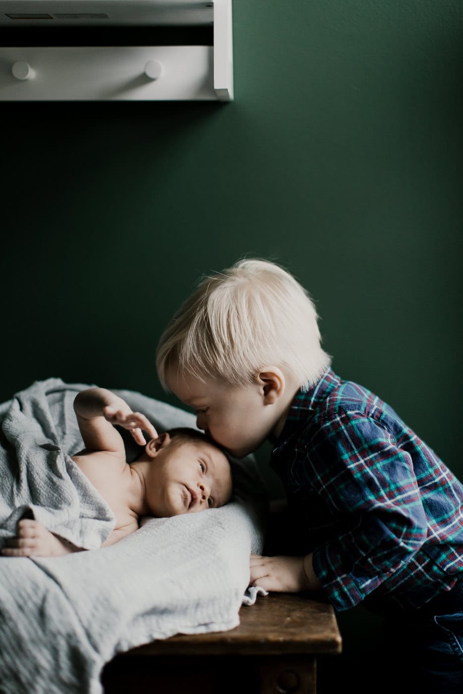 big brother kisses baby brother - in-home newborn session