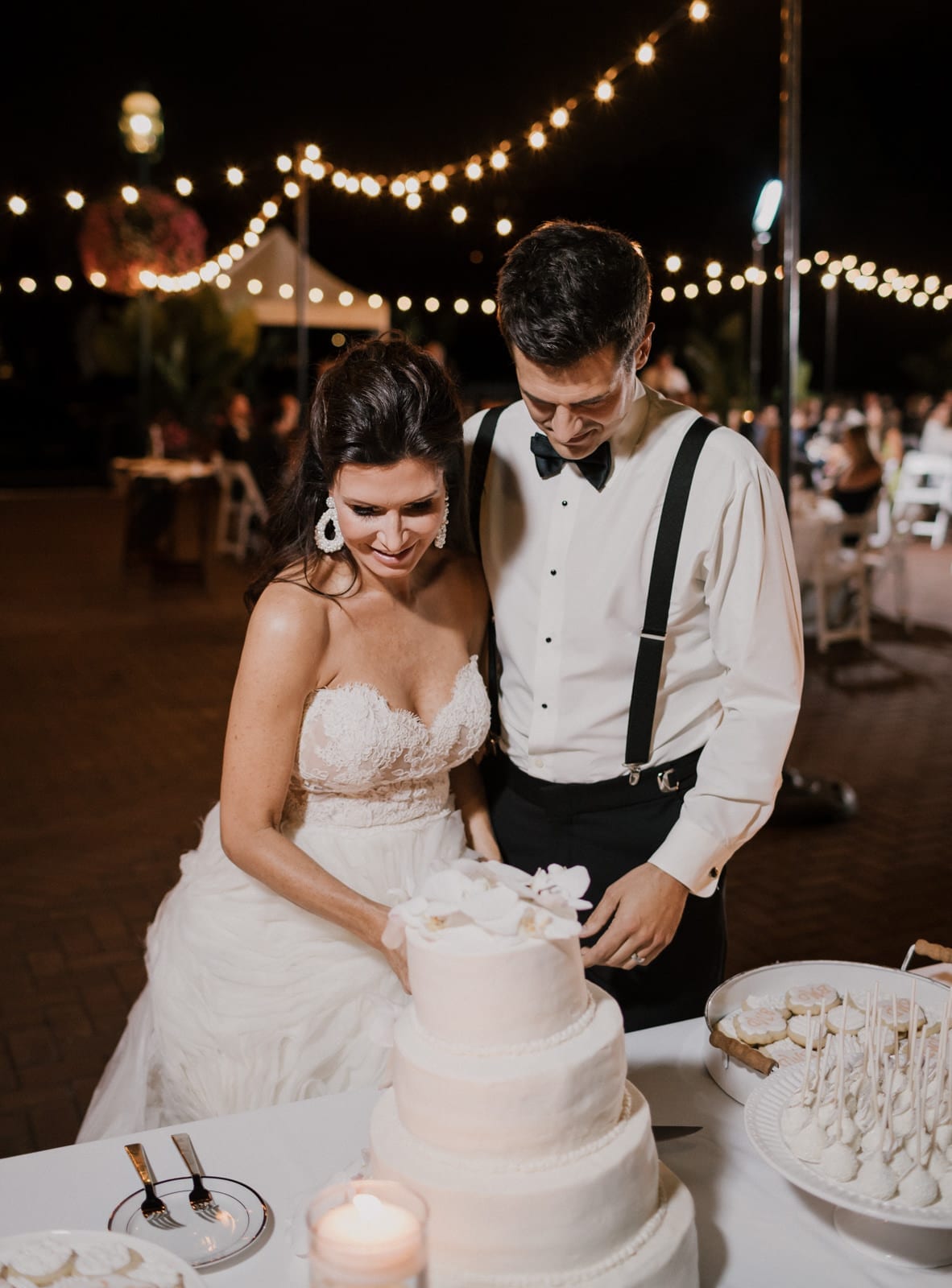 cutting the cake at Franklin Park Conservatory Wedding by Columbus Wedding Photographer