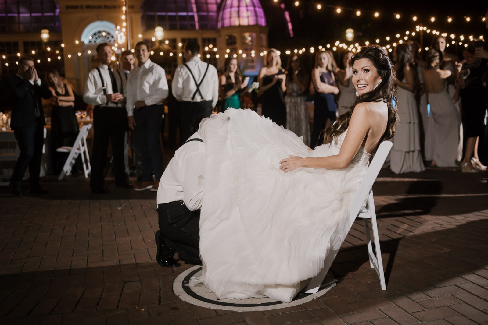 garter toss at Franklin Park Conservatory Wedding by Columbus Wedding Photographer