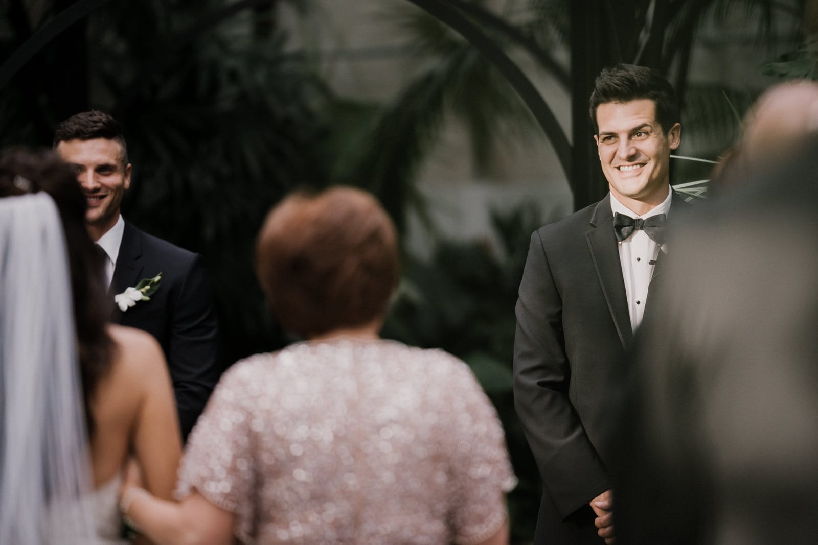 groom watching bride walk down the aisle at Franklin Park Conservatory Wedding by Columbus Wedding Photographer