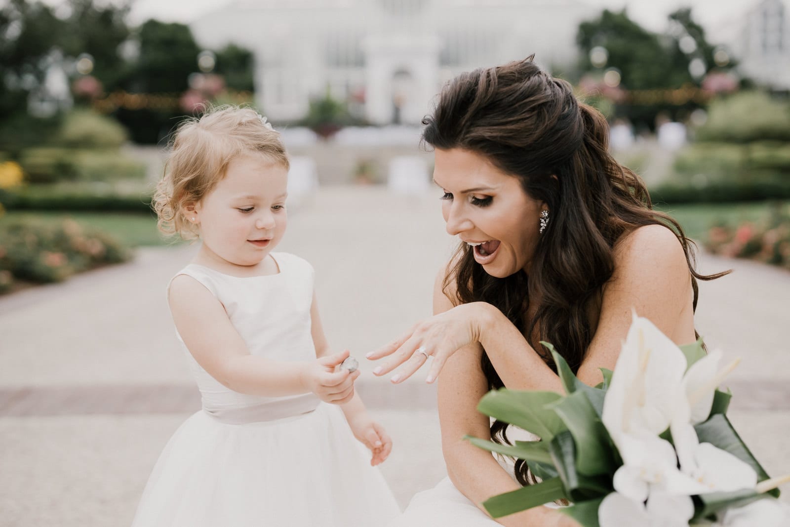 bride and little girl talking at Franklin Park Conservatory Wedding by Columbus Wedding Photographer