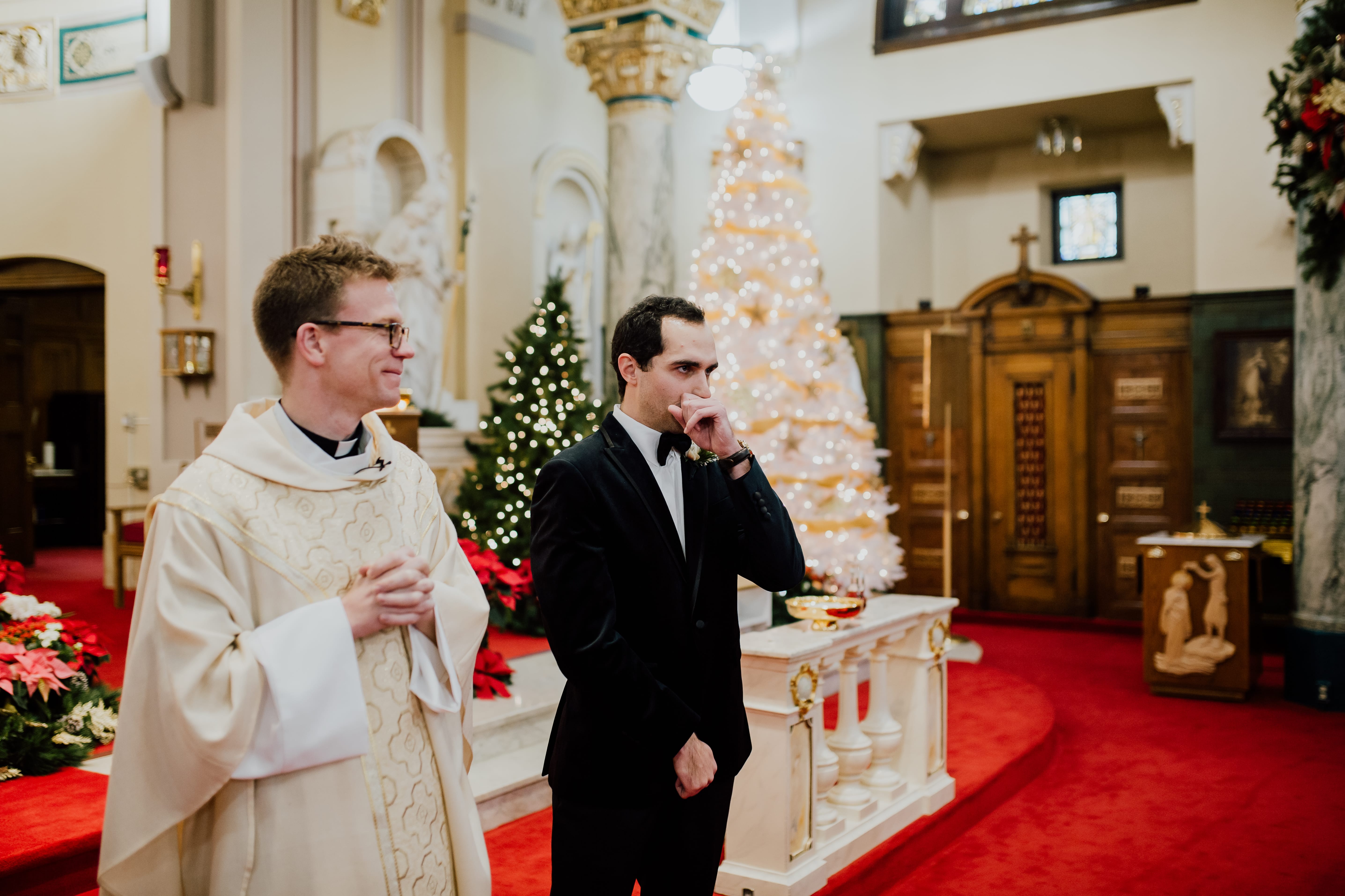 Groom waits with priest for bride