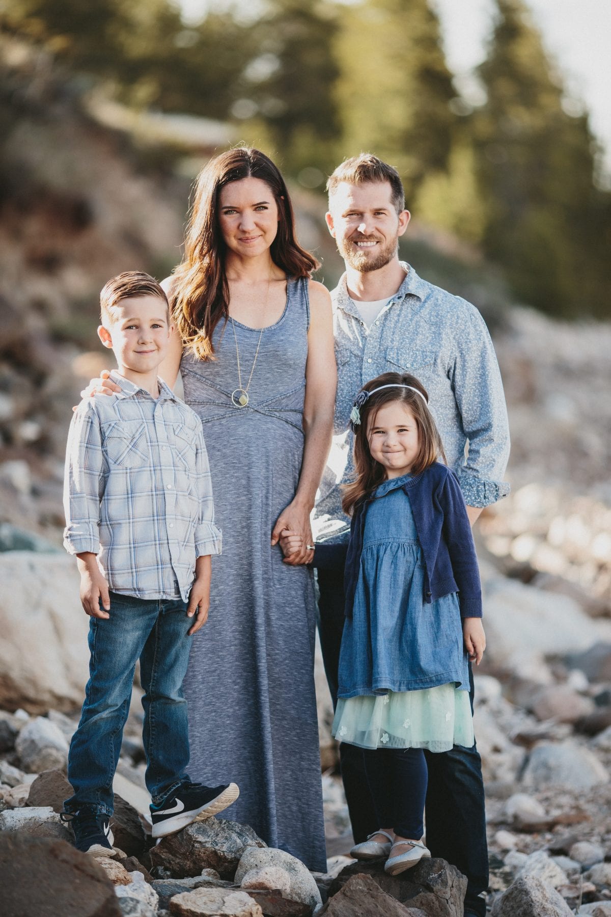 family smiles on lake shore at Grand Lake Colorado Family Portraits - Destination Photographer