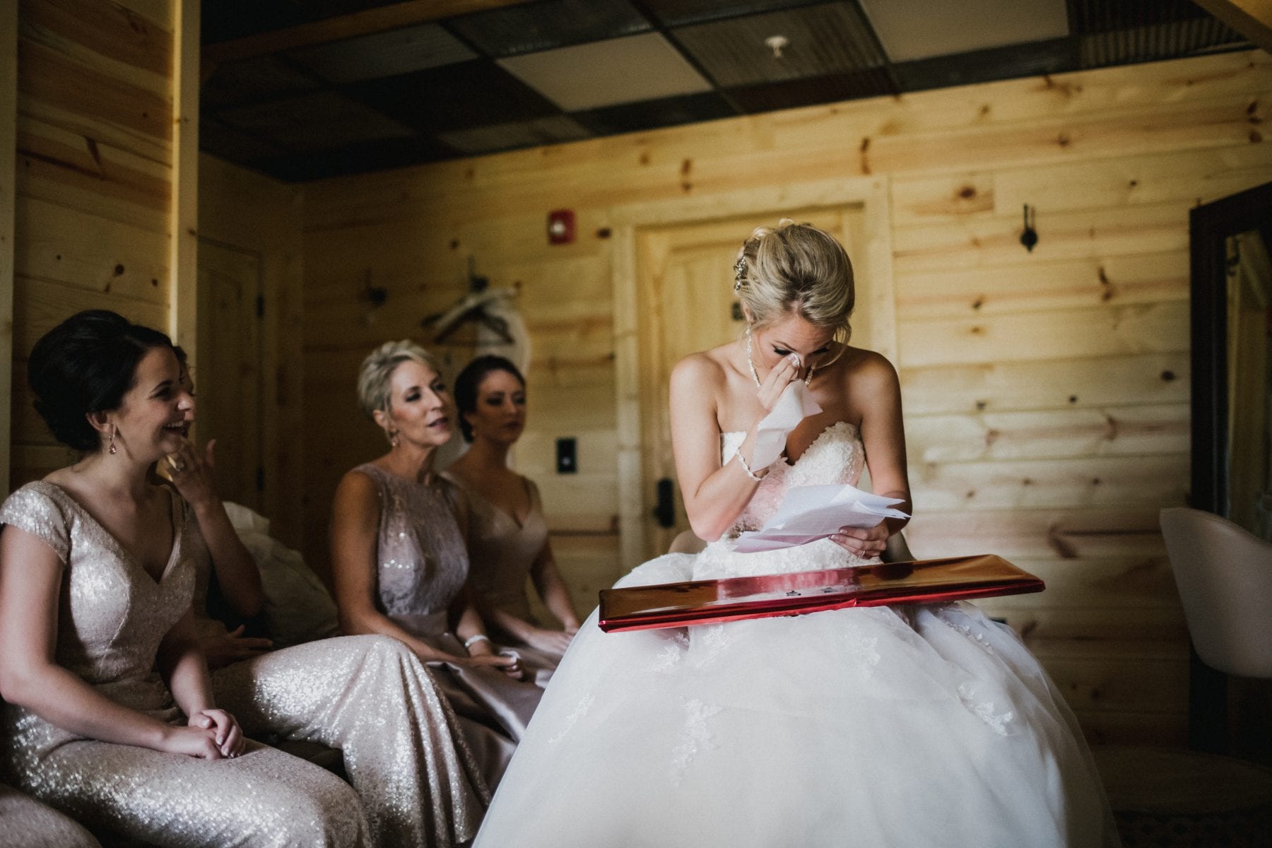 bride tears up reading letter at Rolling Meadows Ranch Wedding - Cincinnati Wedding Photographer