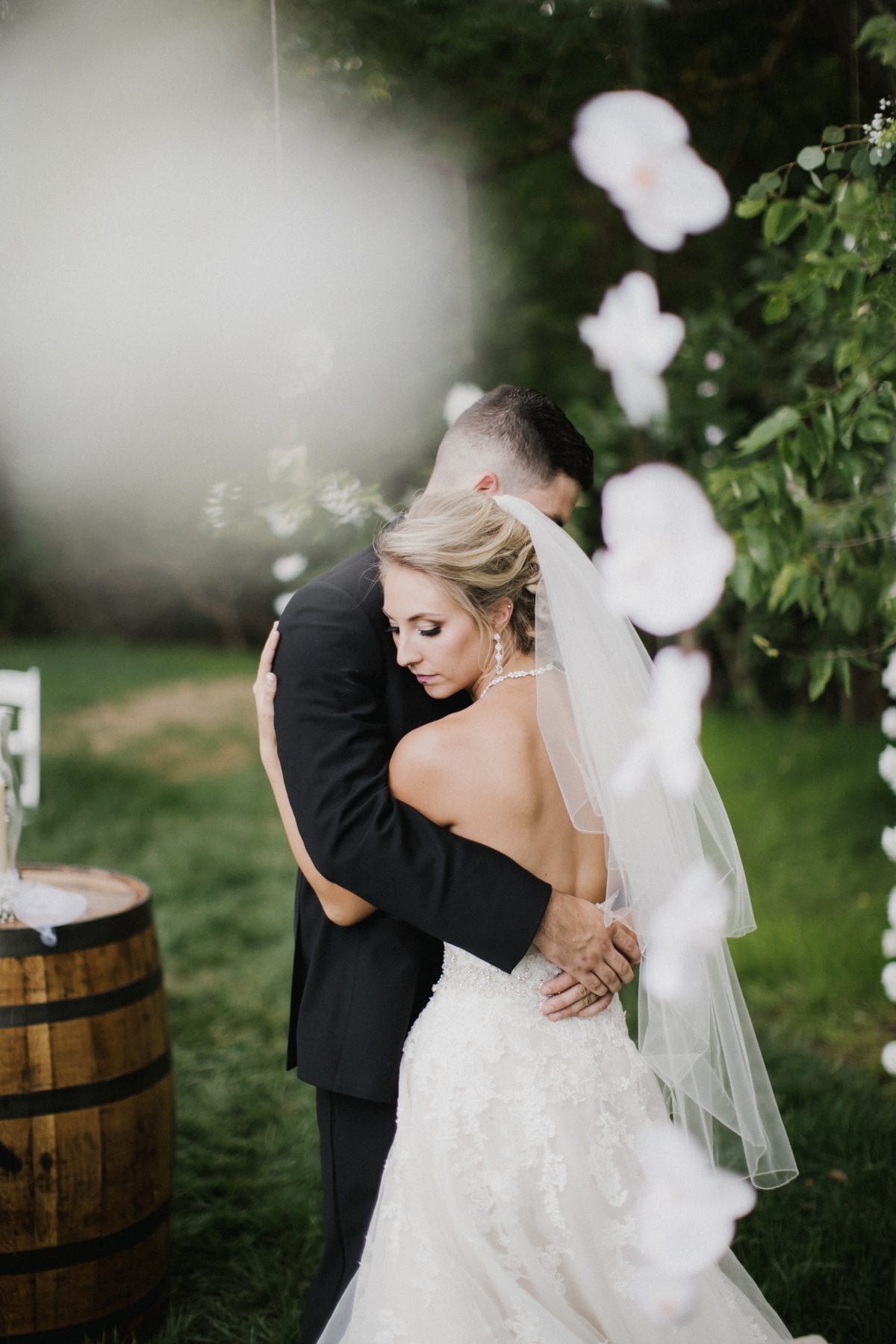 bride and groom embrace at Rolling Meadows Ranch Wedding - Cincinnati Wedding Photographer