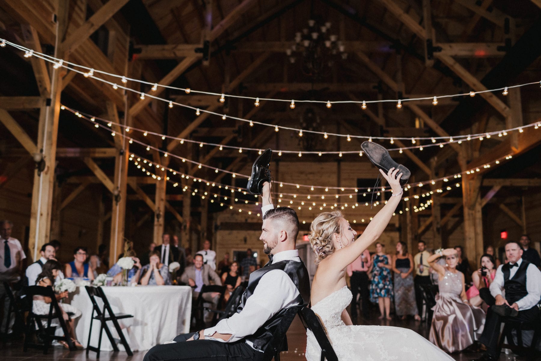 bride and groom play game at wedding at Rolling Meadows Ranch Wedding - Cincinnati Wedding Photographer