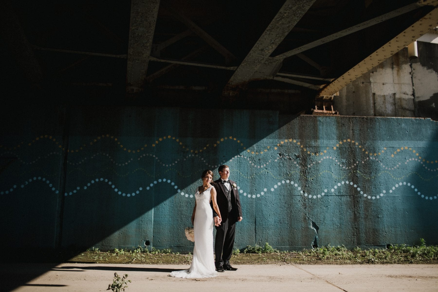 bride and groom holding hands at Top of the Market Wedding - Dayton Wedding Photographer