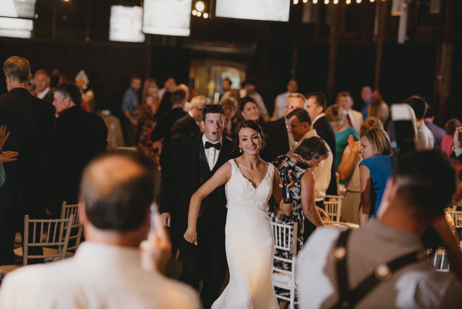 bride and groom celebrating at the reception at Top of the Market Wedding - Dayton Wedding Photographer
