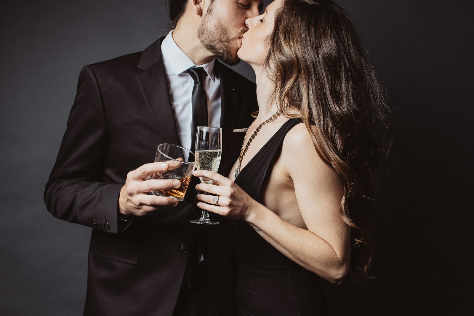 Couple kisses and toasts
