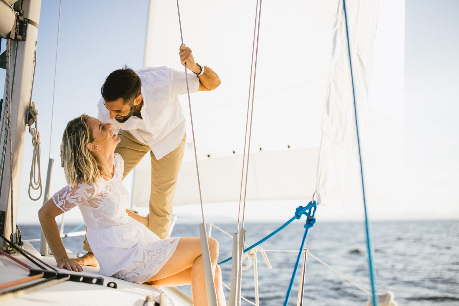 Couple Kisses each other on sailboat