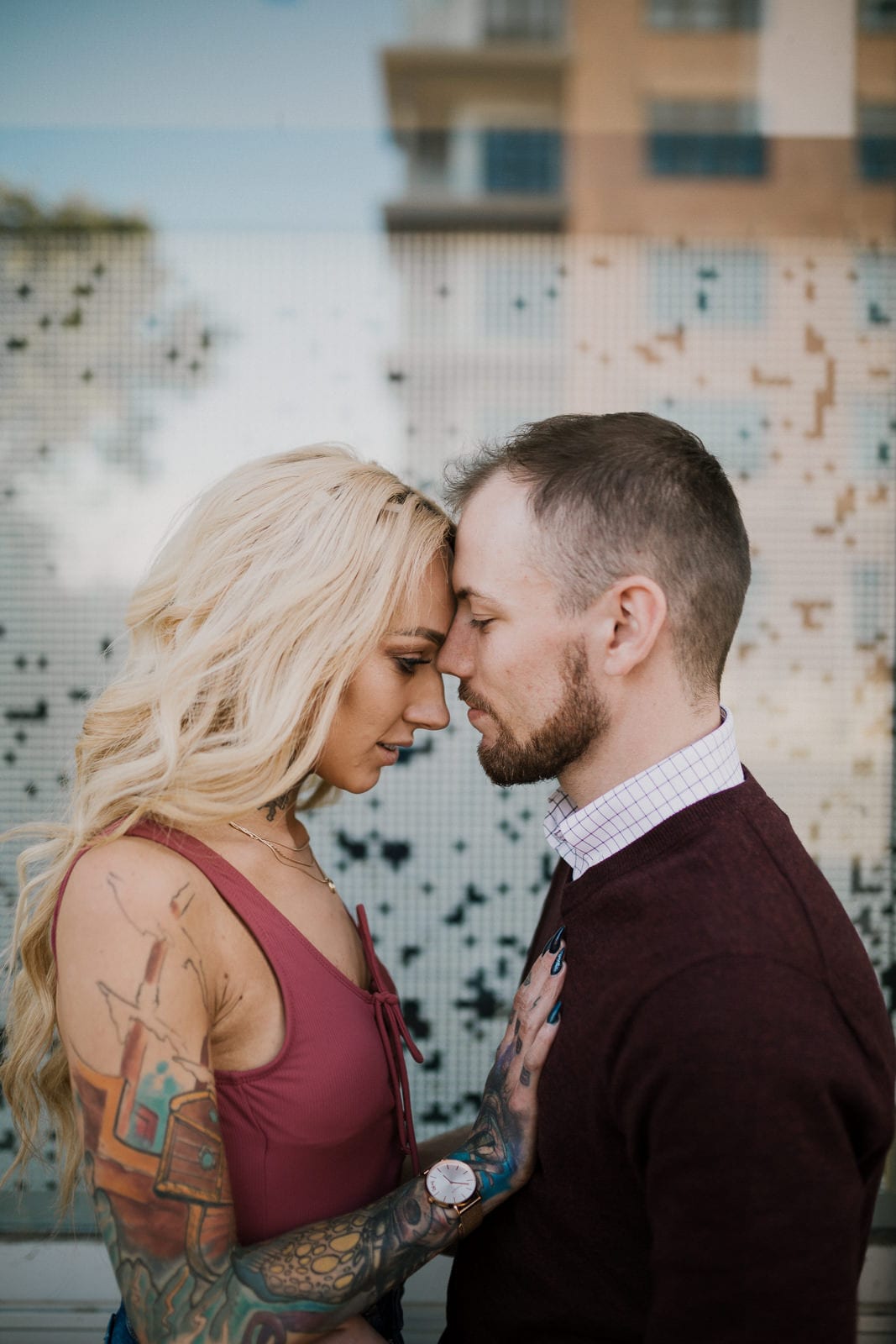 Couple puts foreheads together