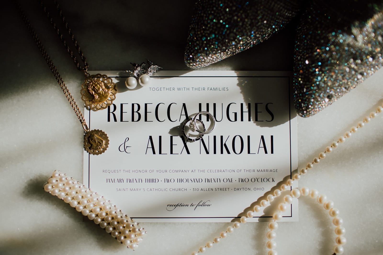Details of pearl wedding jewelry and invitation