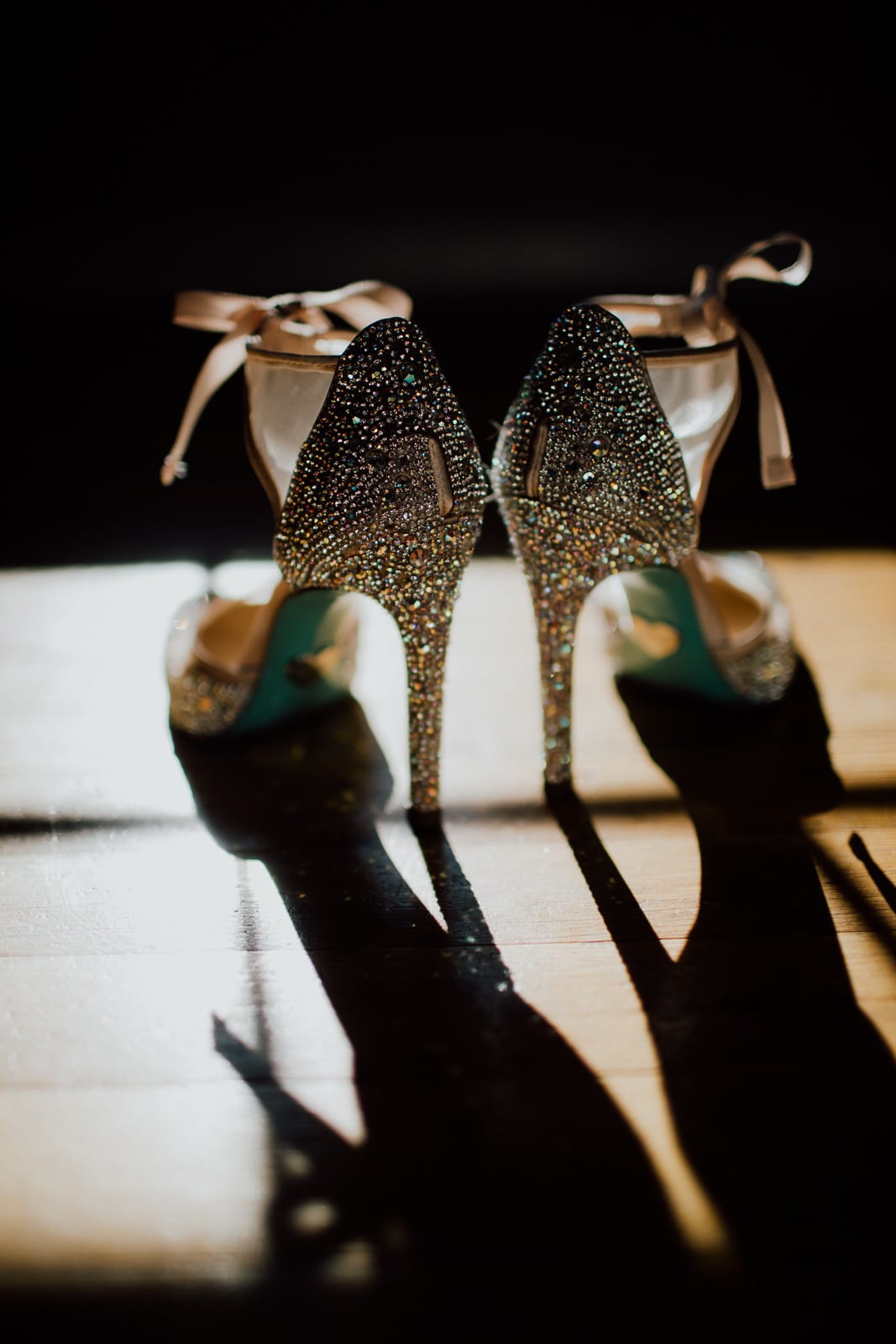 Wedding shoes in sunlight from a window