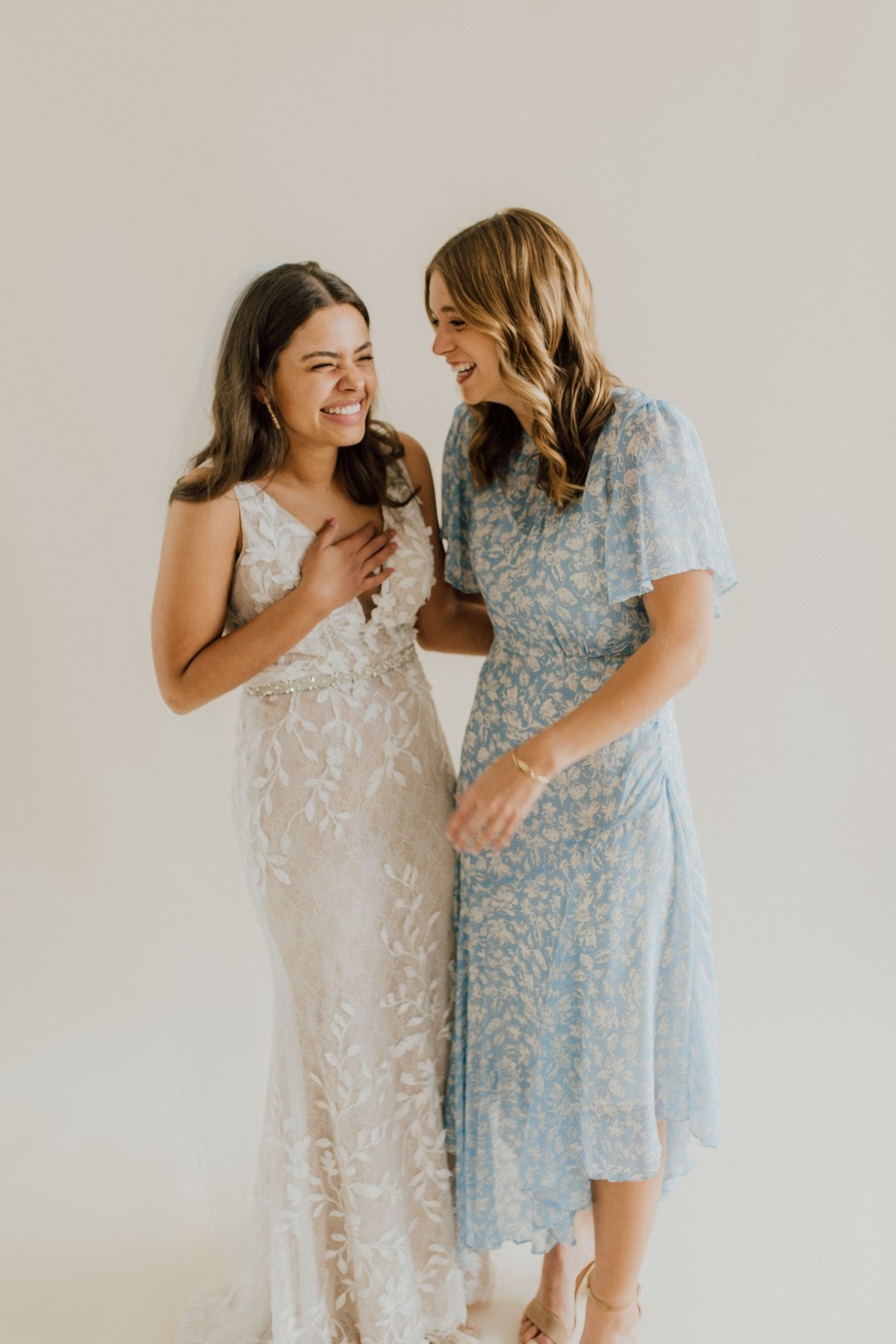 Bride and Maid of Honor laugh together